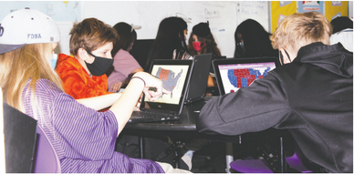 Students vote at Robert Blue Middle School