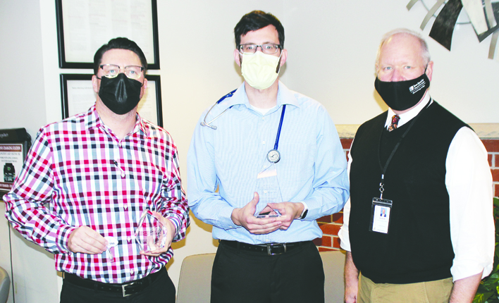 Left to right, Dr. Dan Gabrielson (recipient of the Innovators Award), Dr. Michael McLoughlin (recipient of the Helmsman Award), and ISH CEO Steve Simonin. Photo by Bridget Shileny