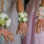 woman in white wedding dress holding white flower bouquet