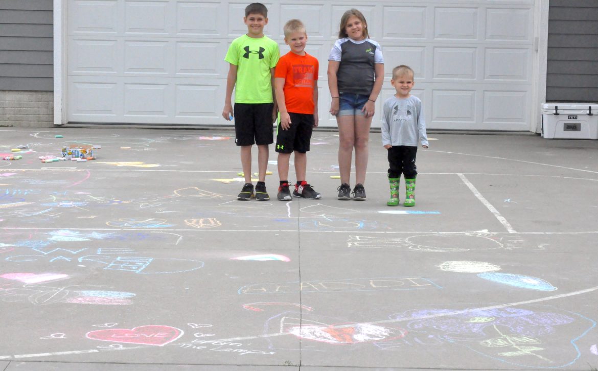 Messages of Love: Family, friends support Hook with driveway art