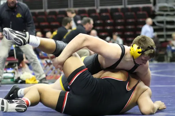 Menke makes it three rounds at State wrestling tournament