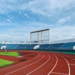 white and blue stadium under blue sky during daytime