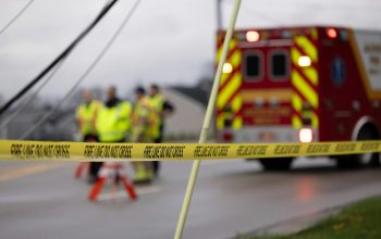 a group of people standing next to a fire truck