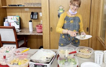 Monica Tyler serves salads during the salad luncheon provided by Valero.