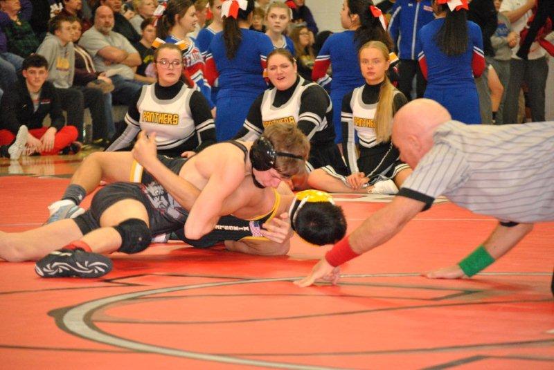 Cowboy wrestlers send three on to state tournament