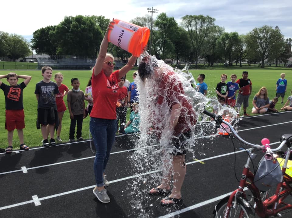 Elementary principal rained on for reading!