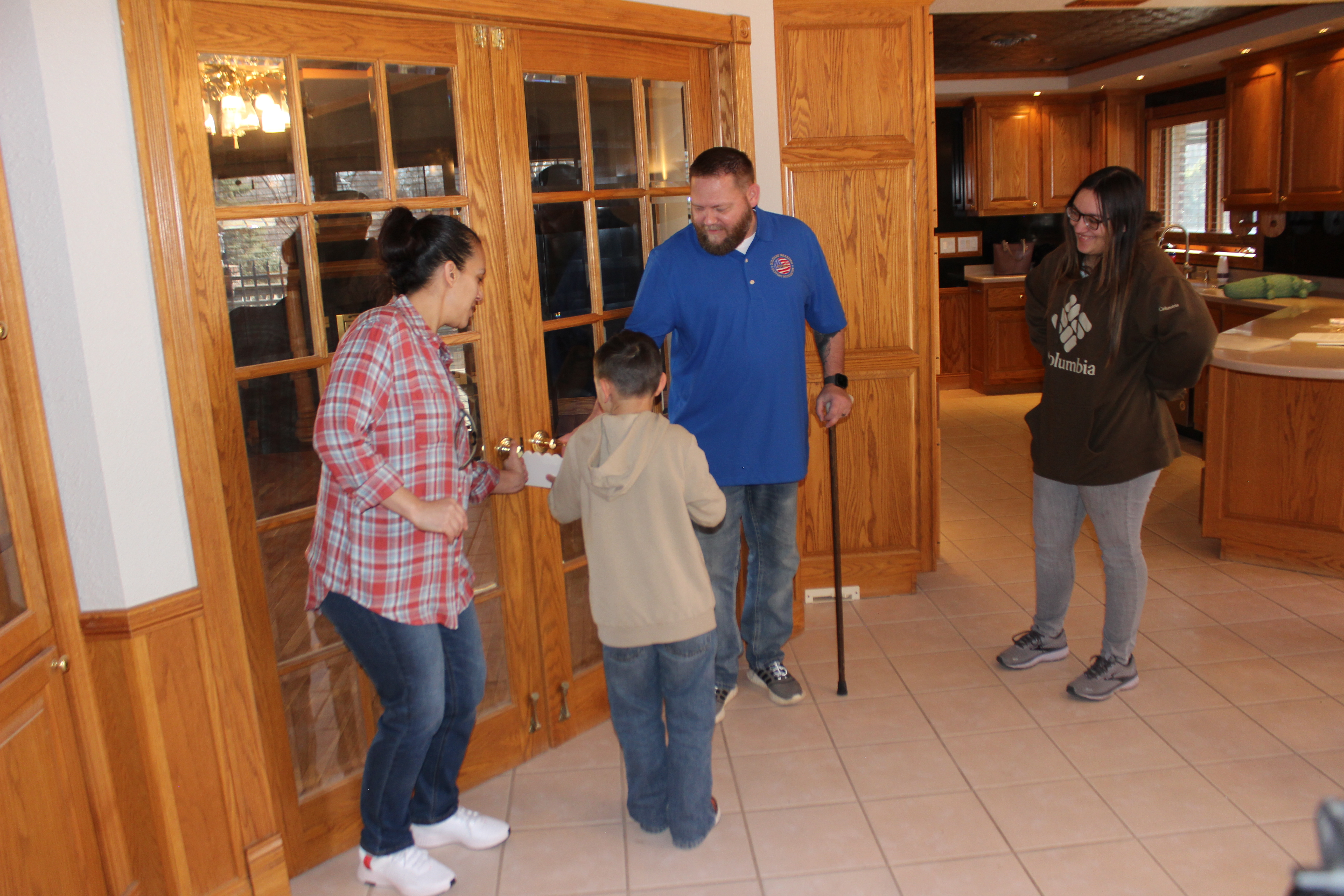 A home of their own- Purple Heart recipient and family receive mortgage-free home in Goldfield