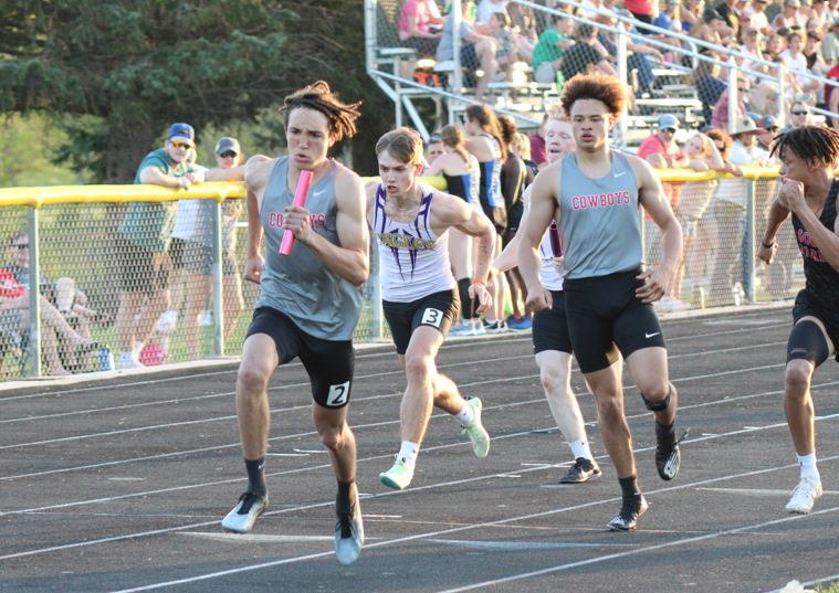 Cowboys track qualify three events at Districts